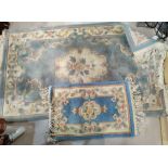 A blue ground floral Chinese rug and another smaller rug