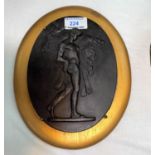 A 19th century Wedgwood oval relief basalt plaque: Hercules and the Erymanthian boar, length 19.5