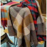 Four travelling rugs in different tartans