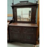 An Art Nouveau mirror back sideboard with double cupboards and drawers bellow