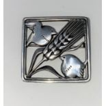 A Georg Jensen Danish silver square brooch with 2 small birds and a stalk of barley between, stamped