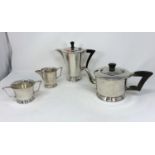 An Art Deco 4 piece silver tea set of circular tapering form on raised foot Sh 1938 & 1950, 36 oz