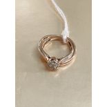 A 9 carat hallmarked gold diamond cluster ring; a 9 carat wedding ring