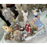 A Meissen style group: 2 seated lovers; 2 Royal Doulton figures; a Royal Crown Derby cat; a Herend