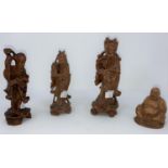 Three 20th century carved wood figures of Immortals heights 14-16 cm and a similar Buddha figure