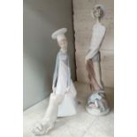 Two Lladro figures: Don Quixote , height 29 cm, and boy with pig, height 25 cm