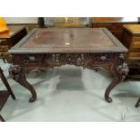 A hardwood occasional table with extensively carved square top, on cabriole legs