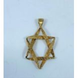 A yellow metal Star of David pendant (tests as 18ct), 2gm