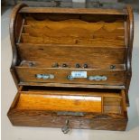An Edwardian oak correspondence box with roll top, base drawer and perpetual calendar, length 30