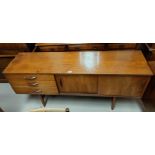 A mid 20th century teak sideboard with double cupboard and triple drawers, 163 x 43cm