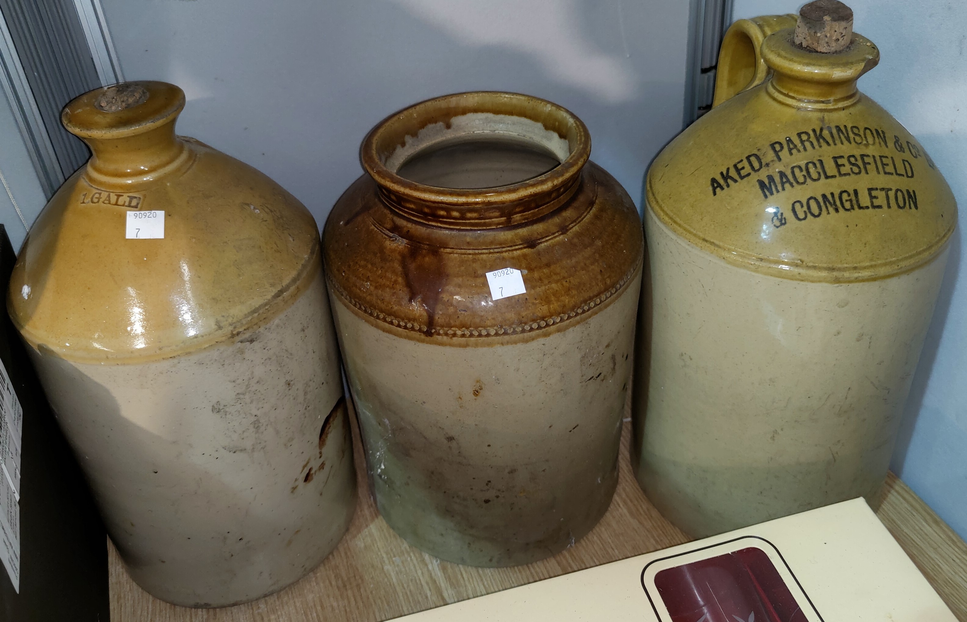 3 stoneware flagons and a jar; a small handknotted Persian rug