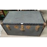 A vintage metal bound steamer trunk
