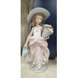 A Lladro Society figure: girl with pot of flowers, height 22 cm