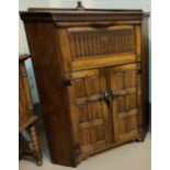 Reproduction Jacobean style oak floor standing corner cupboard , full front over two panelled doors