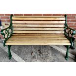 A Victorian style cast metal garden bench