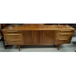 A mid 20th century Morris of Glasgow walnut side board of double central cupboard with six draws