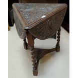 A late trefoil drop leaf table with Macclesfield school carved decoration