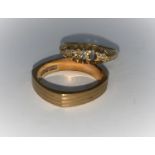 A 9 carat split shank ring 2.9 gm (stone missing); a 9 carat hallmarked gold wedding ring, 2.8 gm