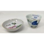 A Chinese tea cup decorated with flowers, 6 character mark to base and similar saucers decorated