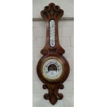 An early 20th century carved aneroid barometer with thermometer, length 65cm 3 Oriental carved