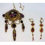 An ornate gem set brooch/locket in the Middle Eastern style with 3 pendants and earrings; a blue gem