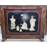 A late 19th century Japanese Shibayama and lacquer fire screen depicting 3 Geishas, in carved frame,