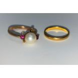 A 22 carat hallmarked gold wedding ring, 2.5 gm; a pearl and ruby set ring, stamped '14k'