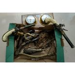 A collection of reproduction pistols and guns; a reproduction ship's clock/barometer; brassware;