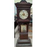An International Time Recording Co London clock made in the USA, in unusual carved wooden case
