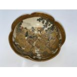 A Satsuma circular lobed bowl decorated with immortals, character seal to base Satsuma and Hododa