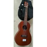 A Kanai ukulele with gig bag, strap, etc.