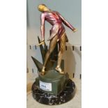 An Art Deco painted cast metal figure of a young woman dancing, with simulated ivory head and hands,