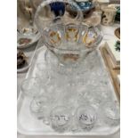 A set of 6 cut glass cups; 2 sets of 6 similar design liqueur glasses; dual coloured glass bowl