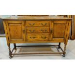 1930's oak sideboard with 2 cupboards and 3 drawers on barley twist legs width 138cm