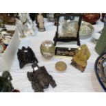 A carved soapstone Buddha figure; 2 oriental carved wood heads; a polished stone small trinket