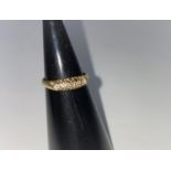 A gypsy style ring set 5 diamonds in 18 carat gold setting
