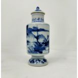 A small Chinese blue and white covered vase decorated with traditional scenes, height 13cm