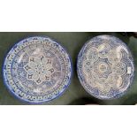 Two middle eastern stoneware plaques, diameters 36 and 33cm