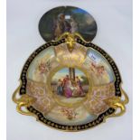 A Vienna trefoil bowl decorated in polychrome with cherub panels and central classical scene "