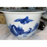 A Chinese blue and white jardiniere, decorated with ducks, with hardwood stand (drill mark to base),