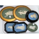 Five various cameo wall plaques in blue/green