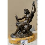 A 19th century bronze depicting a seated figure of Zeus with staff and lightning bolts, unsigned, on