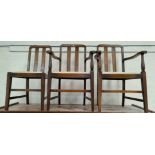A 1930's set of 6 (4 + 2) oak dining chairs with rail backs