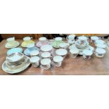 A Royal Albert part Harlequin tea service, a Colclough part tea service and another