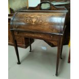 A Sheraton style rosewood cylinder bureau with inlaid decoration, small mirror back with single