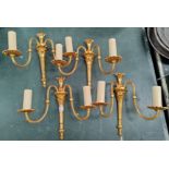 A set of 4 gilt wall lights with double brackets