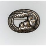 A Georg Jensen Danish silver oval brooch of stylized leaf and brooch design, stamped Georg Jensen in