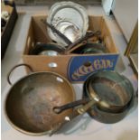 A large selection of 19th century brass and copper pans; etc.