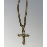 A 9 carat hallmarked gold gem set cross and chain, 6.9 gm gross