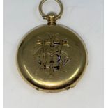 A yellow metal open faced lady's fob watch, monogrammed to reverse, tests as 18 carat +